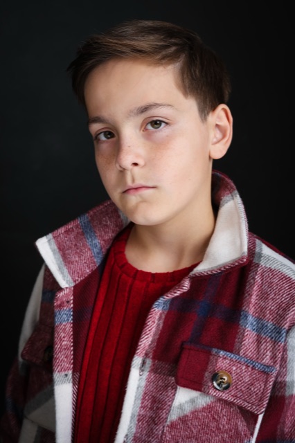 Jett Belew — theatrical, plaid jacket